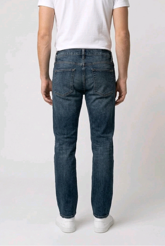 Man wearing blue jeans and a white t-shirt back view