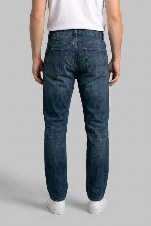 Man wearing blue jeans back view