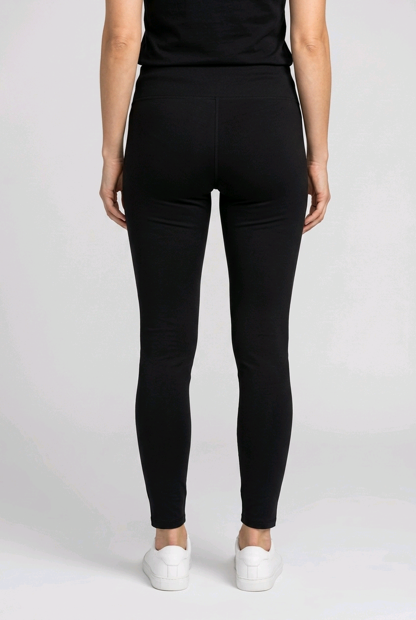 Woman wearing black Puma leggings back view