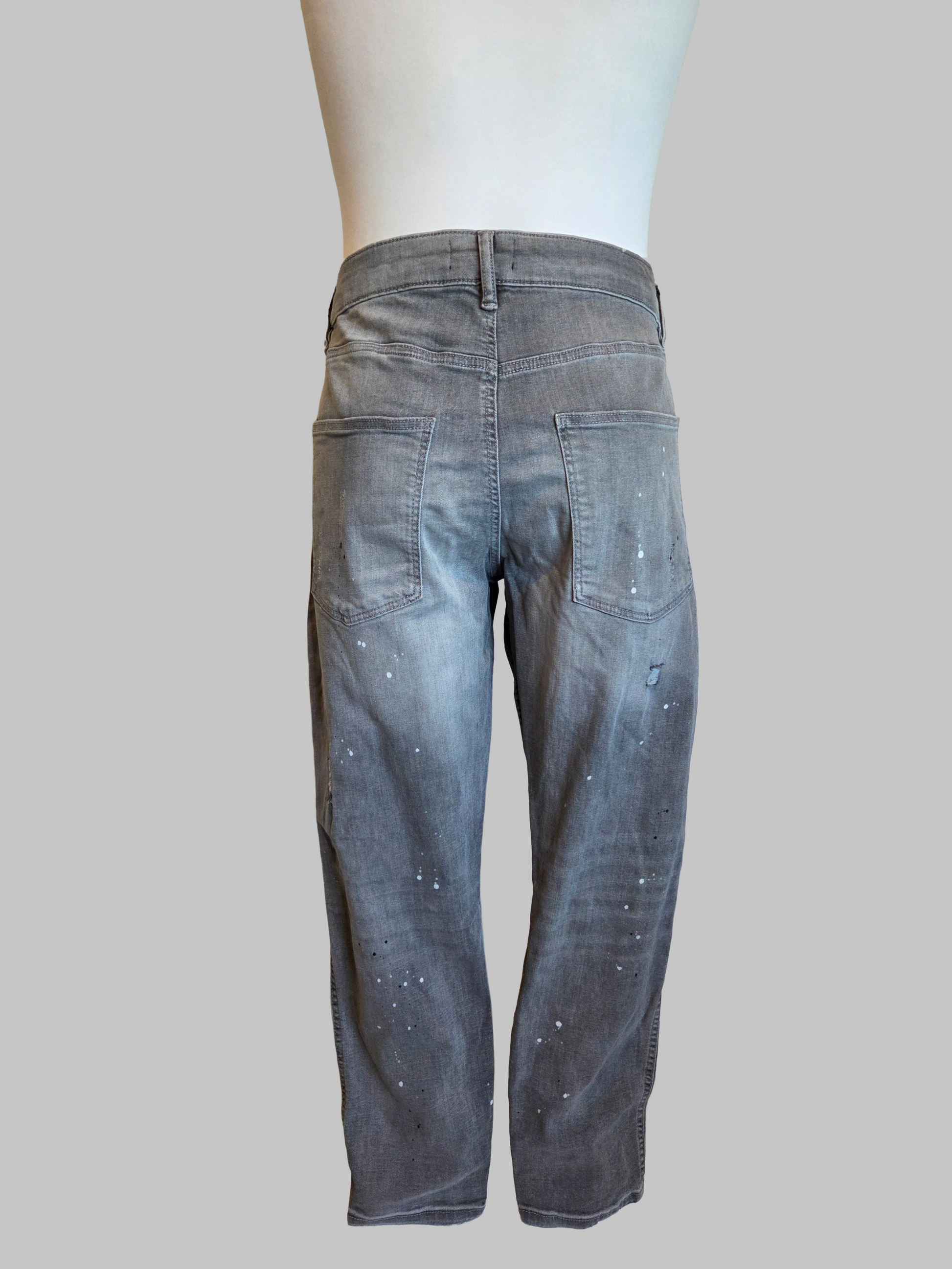Back view of a pair of grey jeans