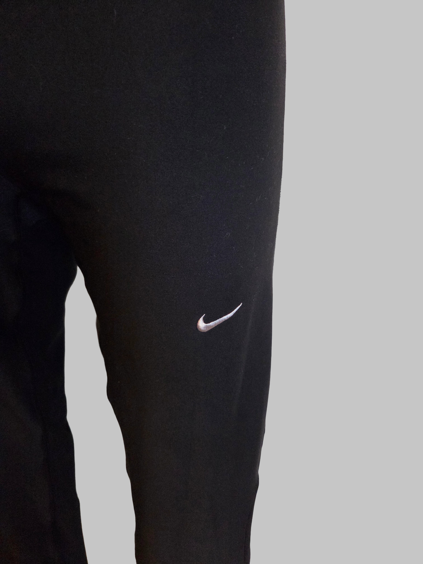 Black Nike pants with a logo 