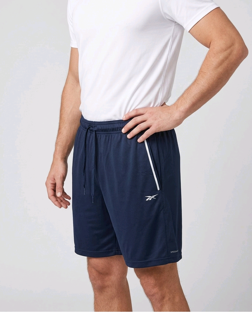 Man wearing navy Reebok shorts