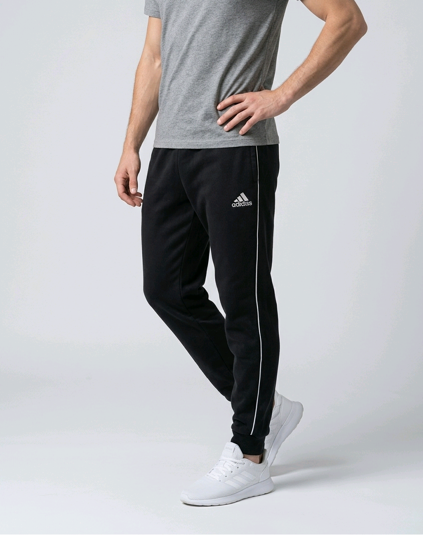Man wearing a pair of black Adidas joggers