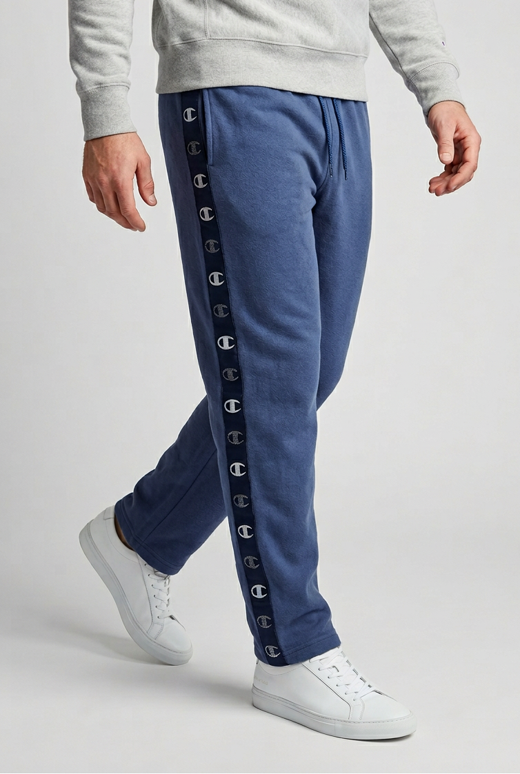 Man wearing a pair of blue Champion joggers