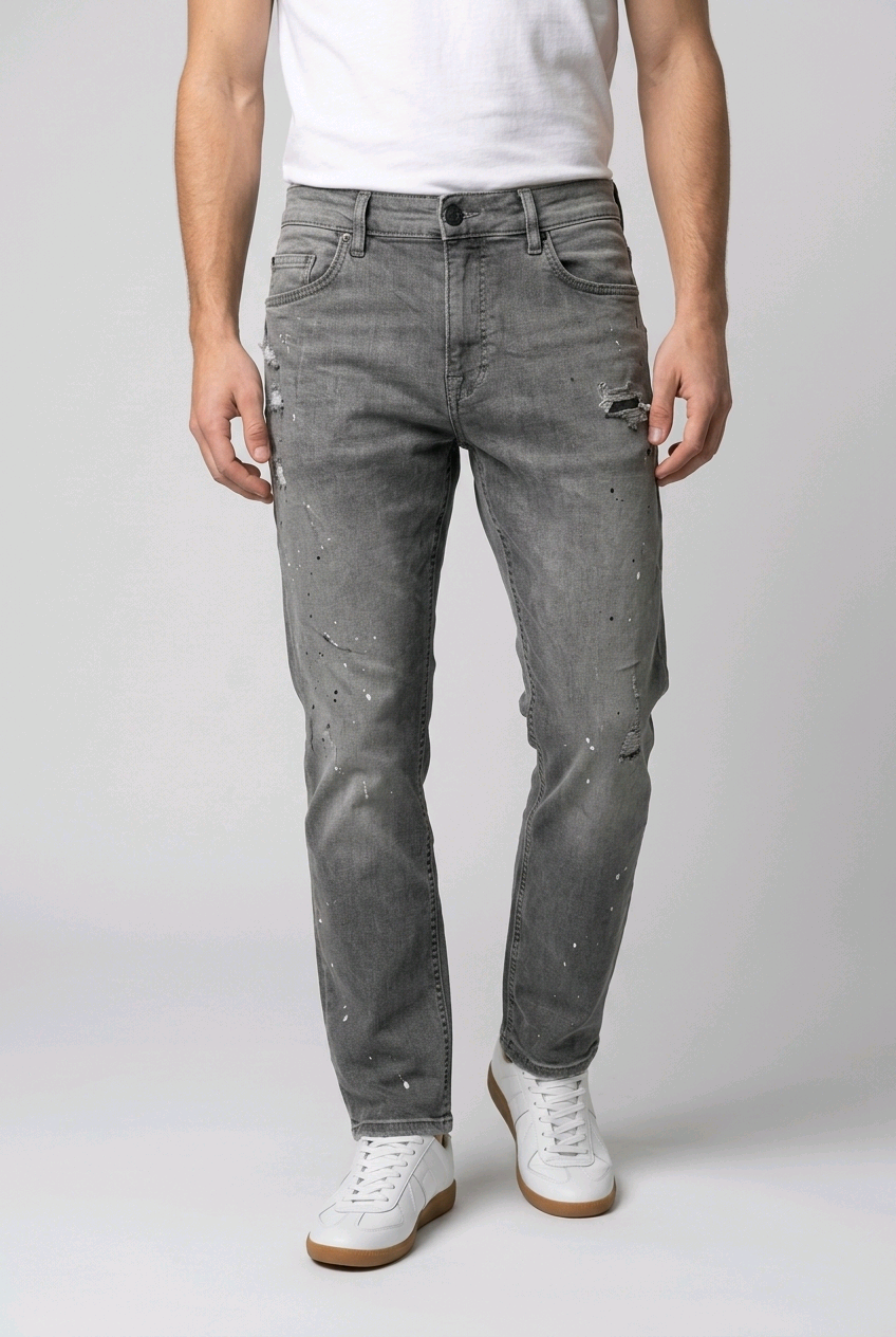 Man wearing a pair of grey distress jeans