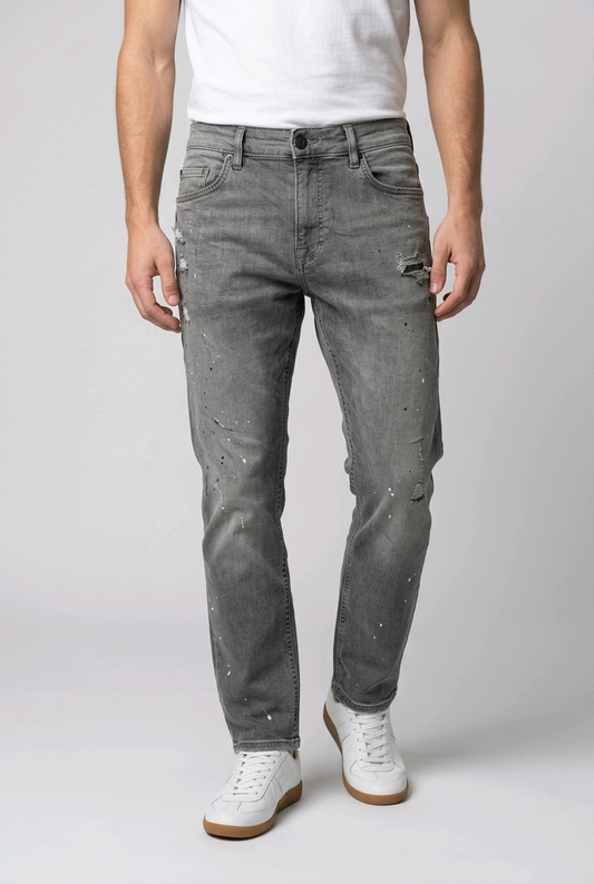 Man wearing a pair of grey distress jeans