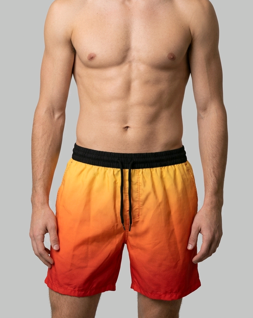 Man wearing a colorful swim shorts with a gradient from orange to red 
