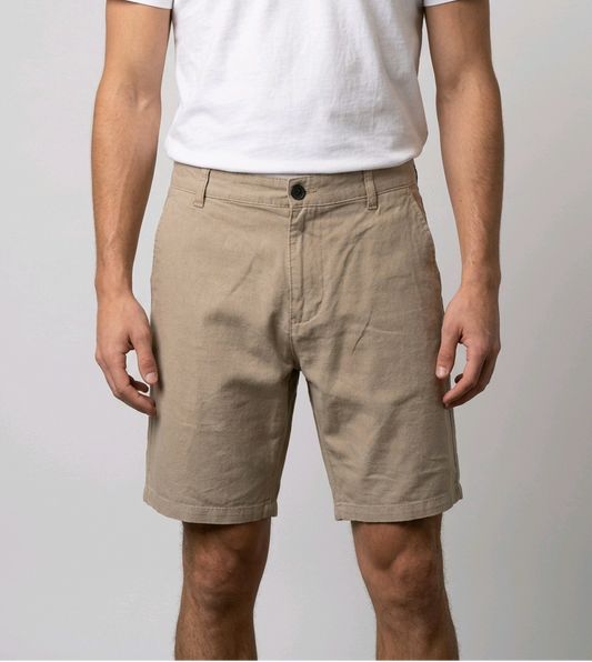 Man wearing beige shorts and a white t shirt