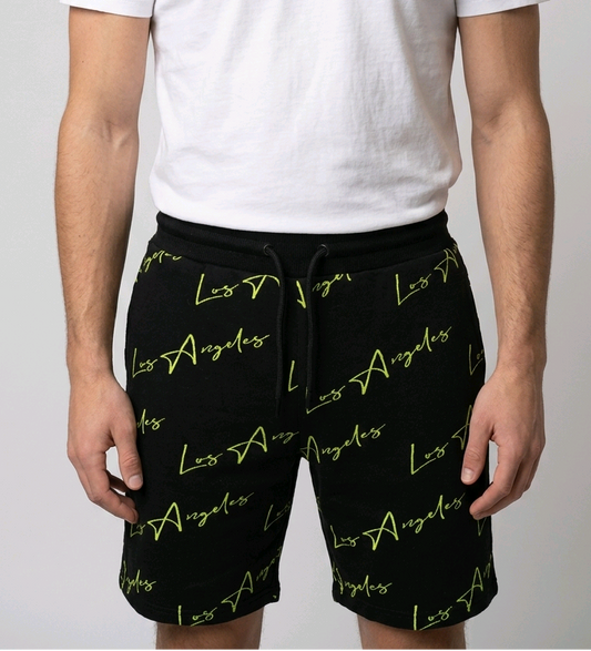 Man wearing black Los Angeles print shorts