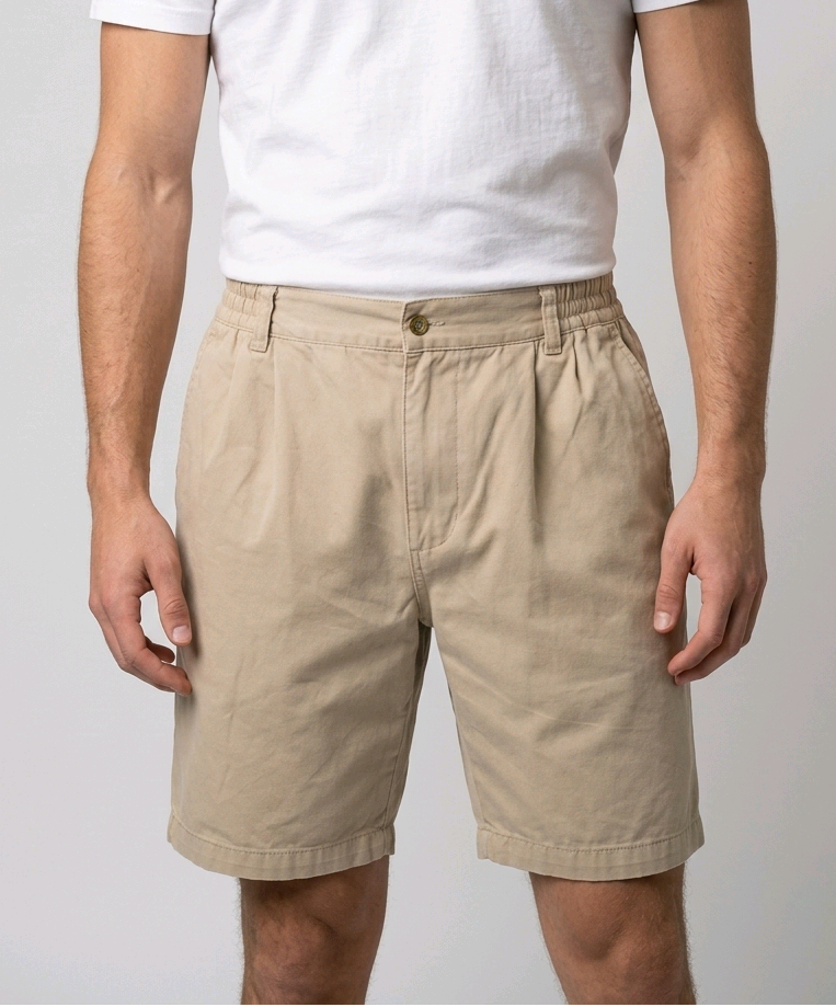 Man wearing beige shorts with a white t shirt