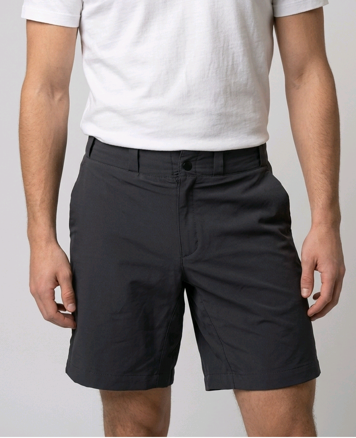 Man wearing a white t-shirt and grey shorts 