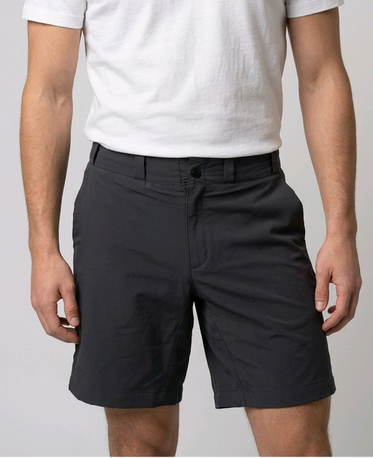 Man wearing a white t-shirt and grey shorts 