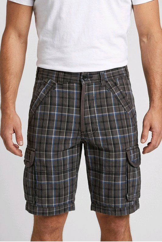 Man wearing checked shorts with a white t shirt