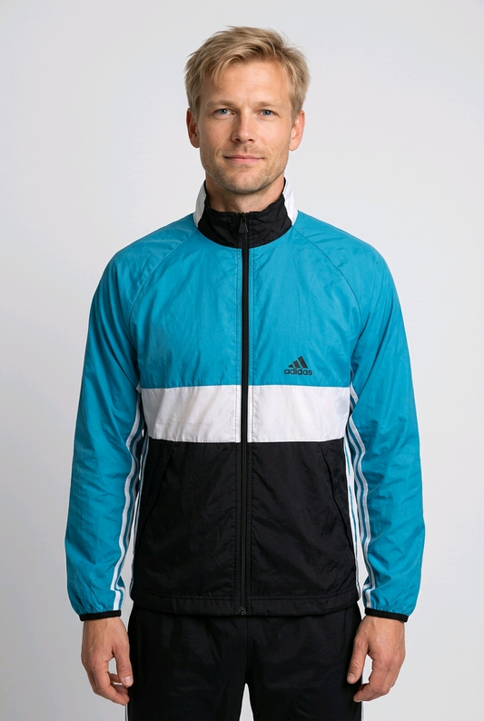 Man wearing a black / white / turquoise Adidas jacket