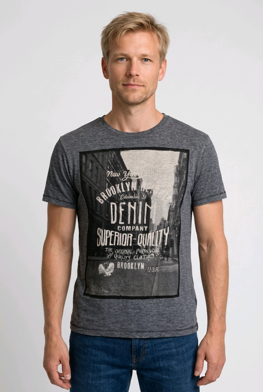 Man wearing a grey t-shirt with a graphic design