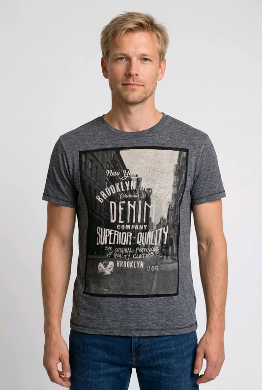 Man wearing a grey t-shirt with a graphic design