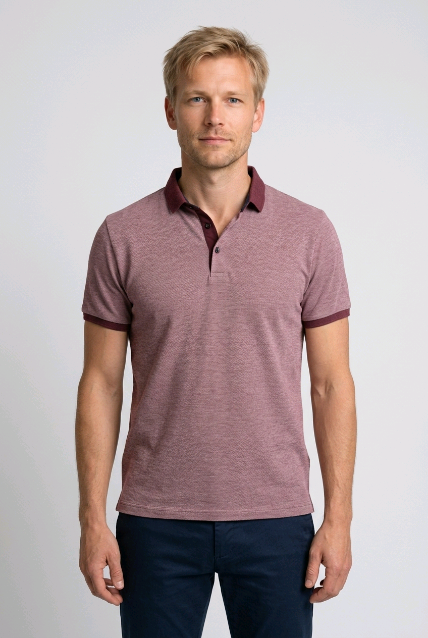 Man wearing a maroon polo shirt with burgundy trim 