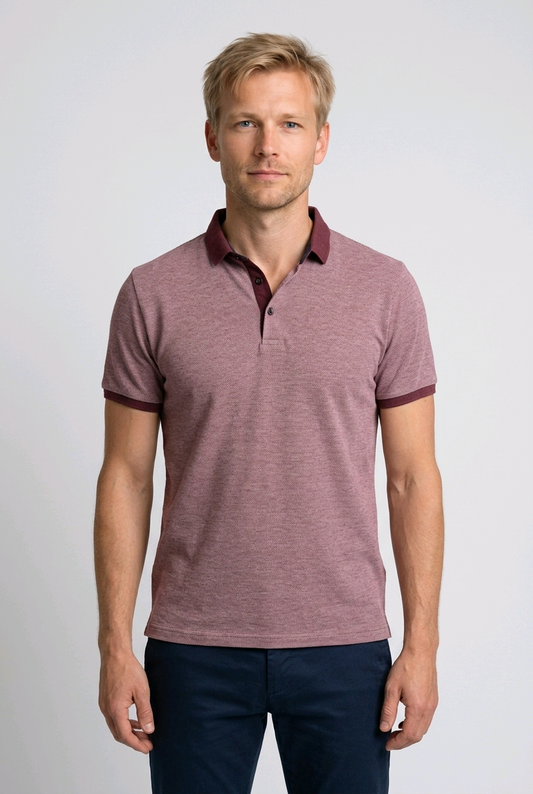 Man wearing a maroon polo shirt with burgundy trim 