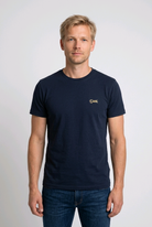 Man wearing a Diesel navy blue t-shirt with a small logo