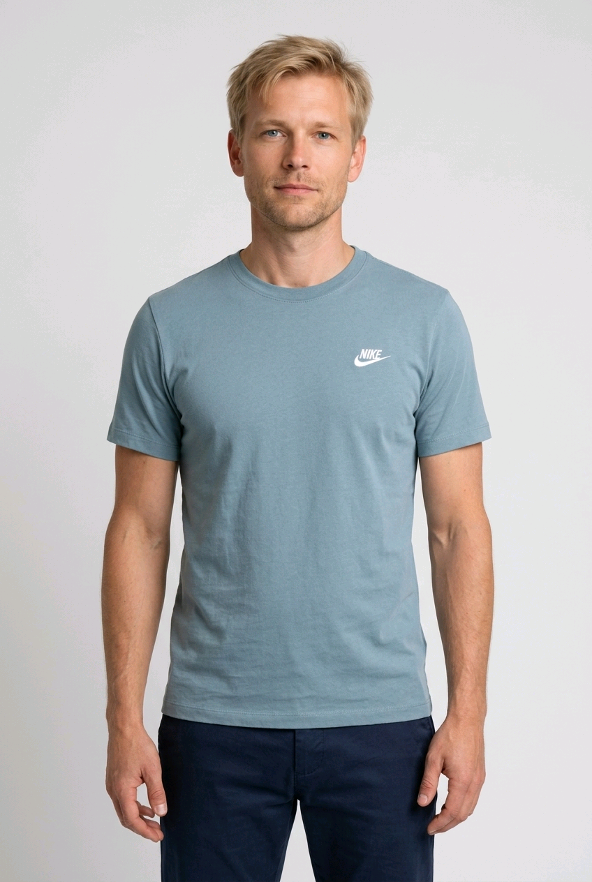 Man wearing a light blue t-shirt with a Nike logo 