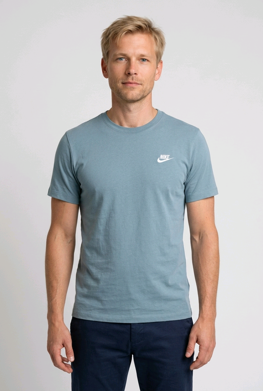 Man wearing a light blue t-shirt with a Nike logo 