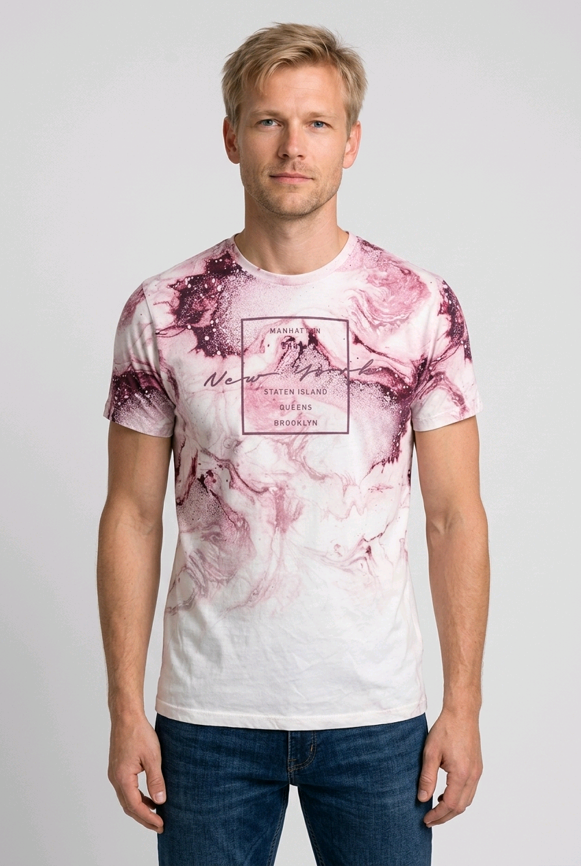 Man wearing a white t-shirt with pink abstract design and text 