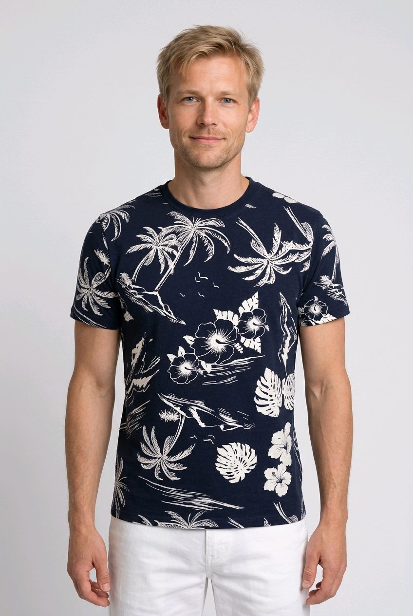 Man wearing a navy and white palm tree t shirt