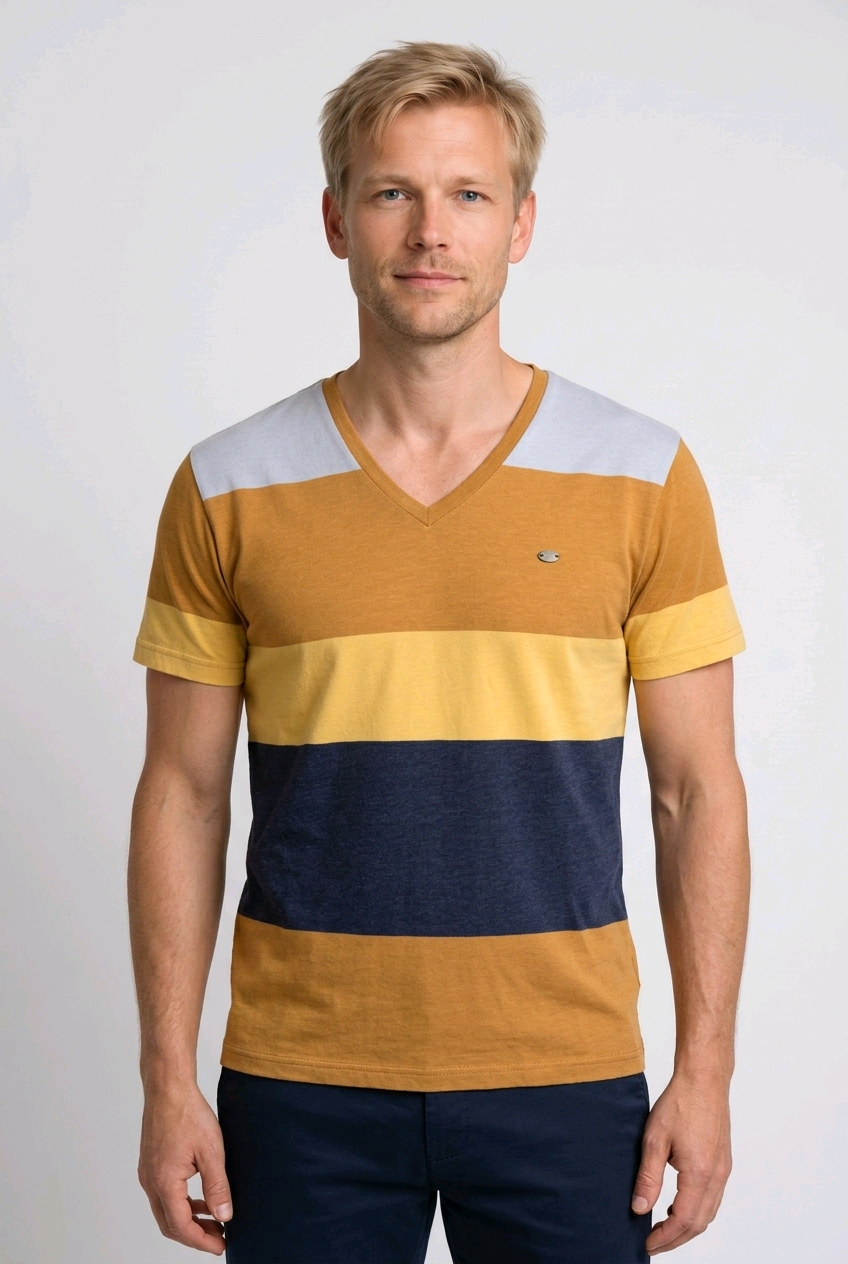 Man wearing a striped shirt with yellow, blue, and mustard colours 
