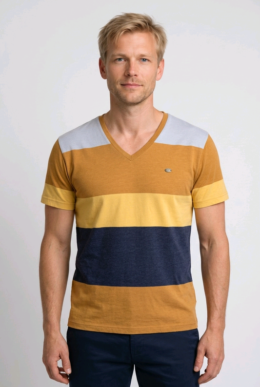 Man wearing a striped shirt with yellow, blue, and mustard colours 