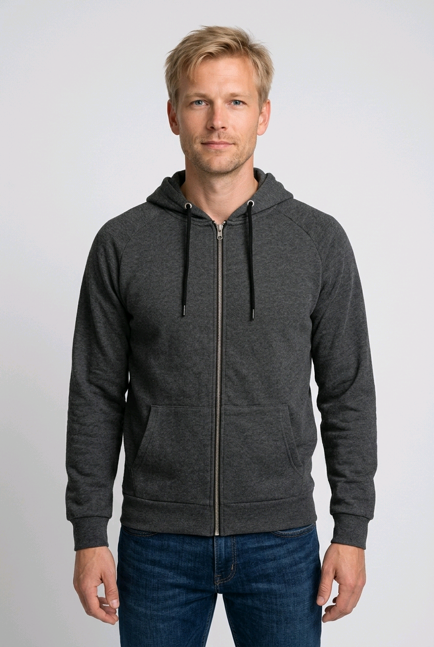 Man wearing a grey zip up hoodie