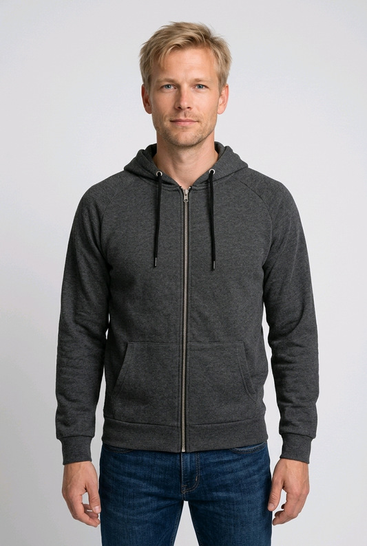 Man wearing a grey zip up hoodie