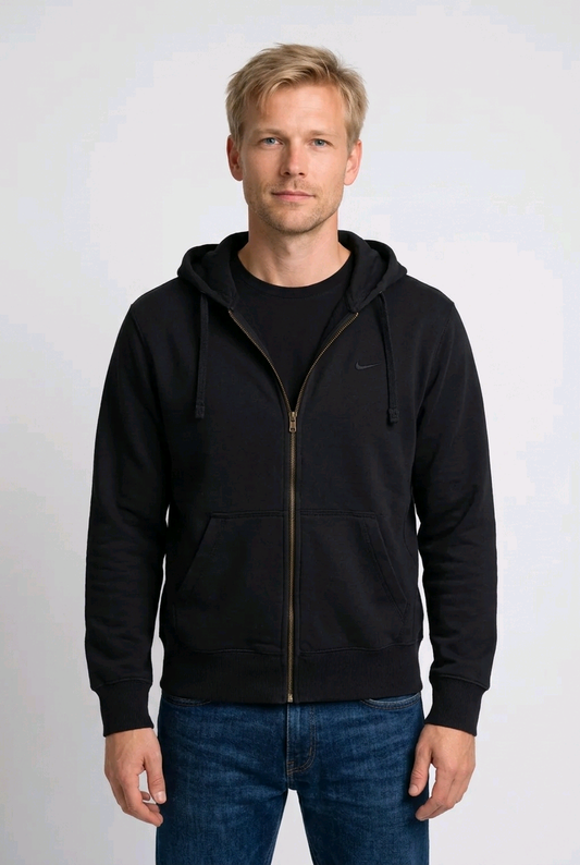 Man wearing a black Nike hoodie