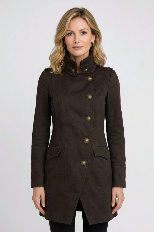 Woman wearing a Khaki coat with gold buttons 