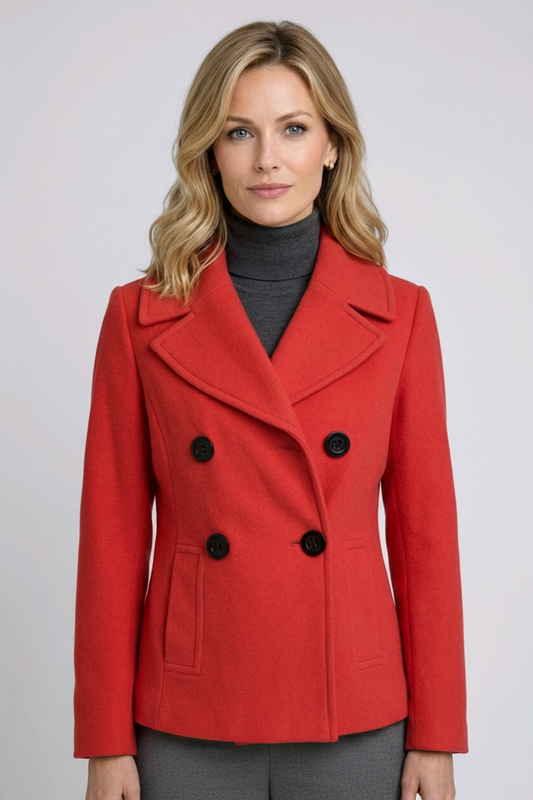 Woman wearing a red coat with black buttons 