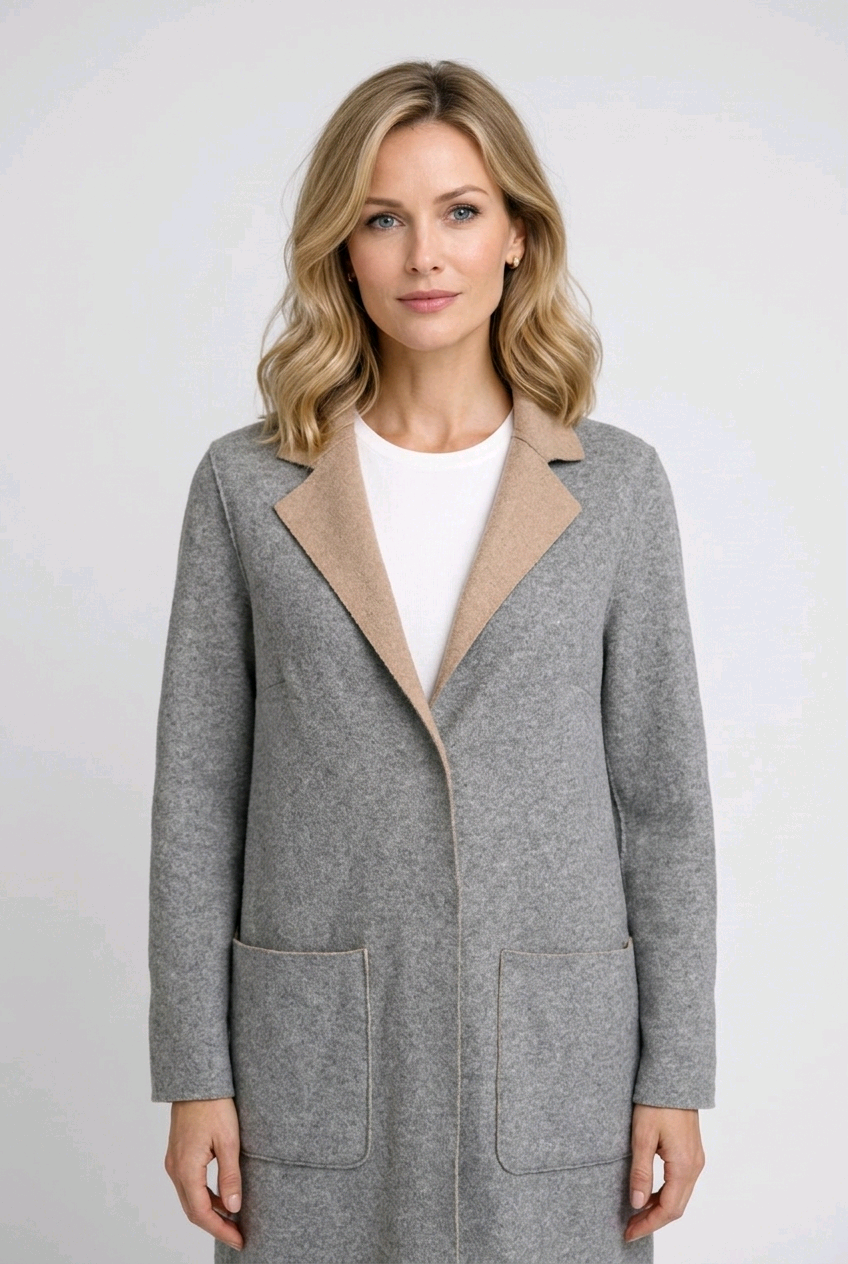 Woman wearing a gray coat with a beige collar 