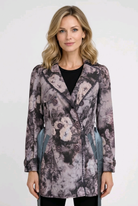 Woman wearing a patterned floral coat 