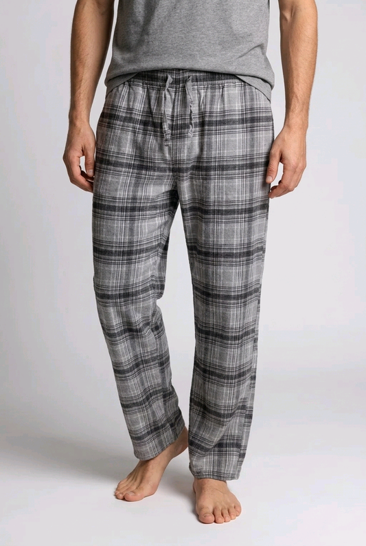 Man wearing grey check pyjama bottoms 
