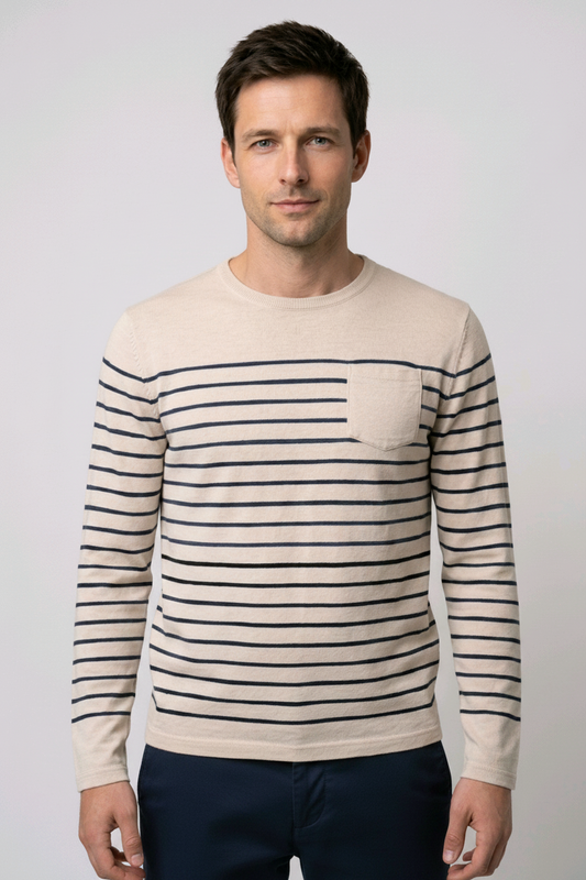 Man wearing a beige sweater with navy horizontal stripes 