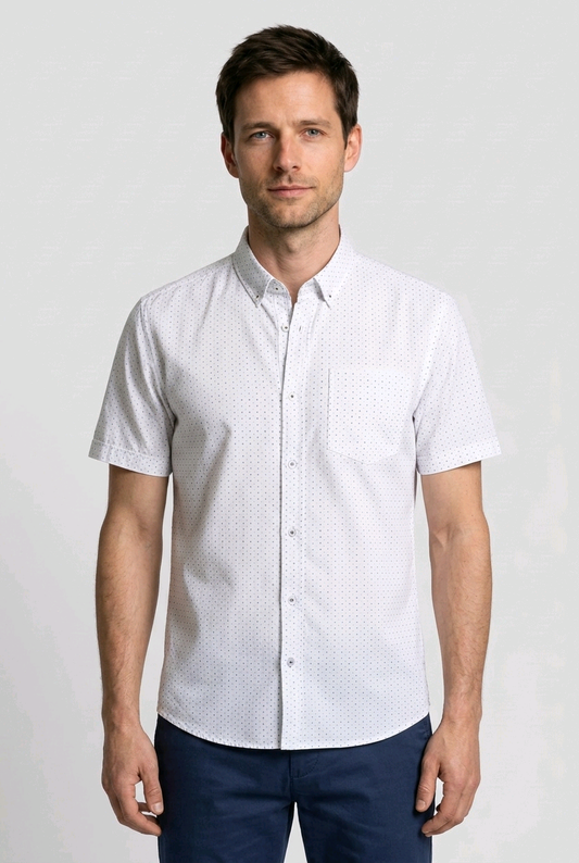 Man wearing a white short-sleeve shirt with a subtle pattern 