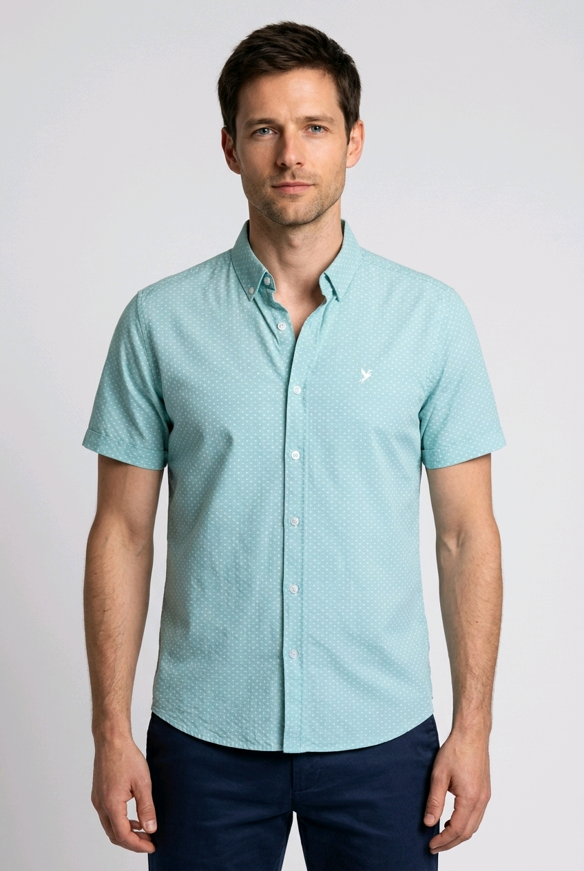 Man wearing a light blue patterned shirt 