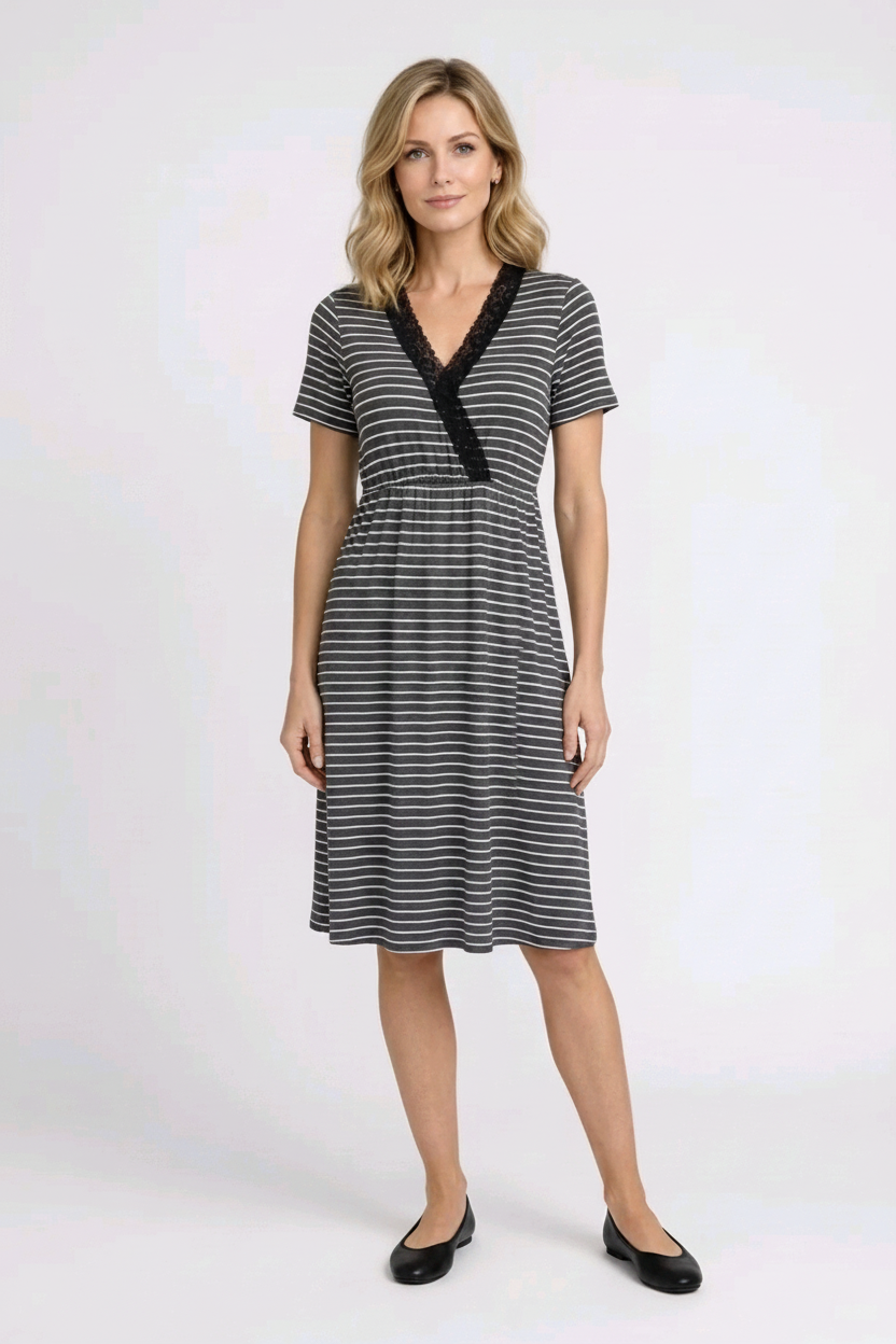 Woman wearing a black and white striped dress 