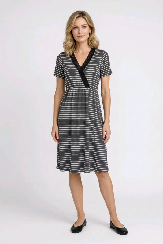 Woman wearing a black and white striped dress 