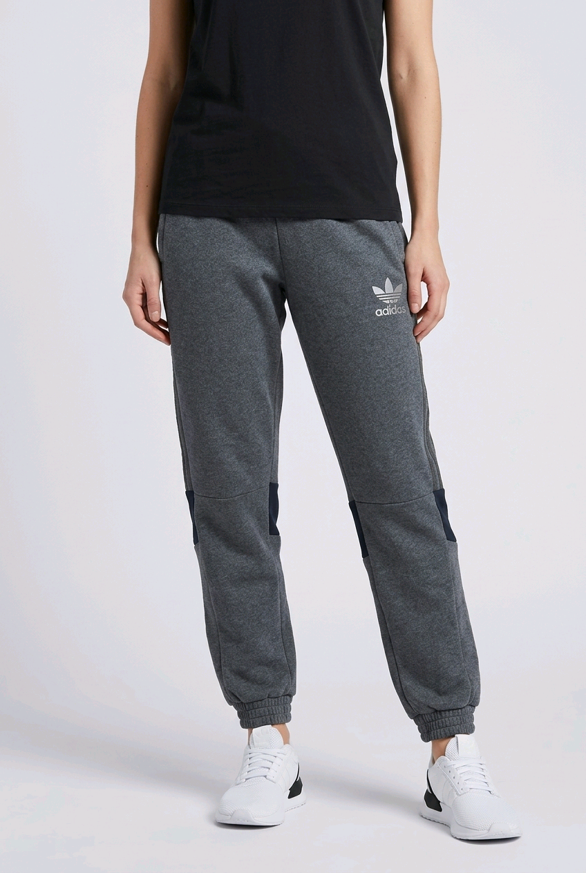 Woman wearing slate blue Adidas joggers