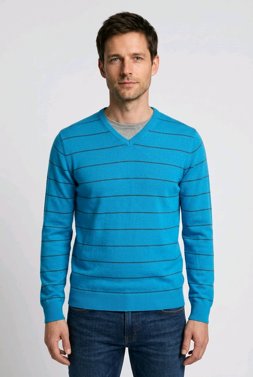 Man wearing a blue striped v neck jumper