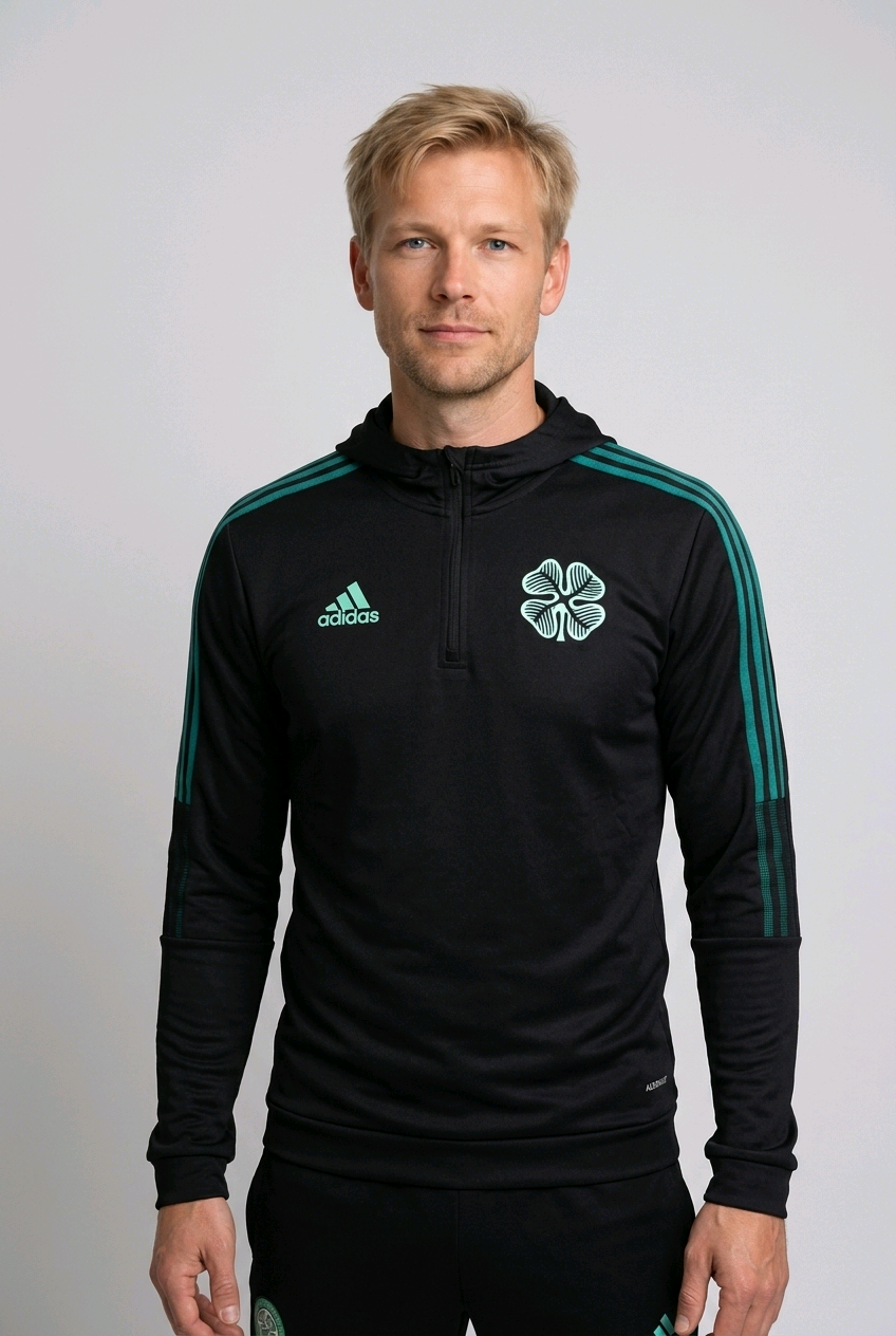 Man wearing a black Adidas sports jacket with Celtic 