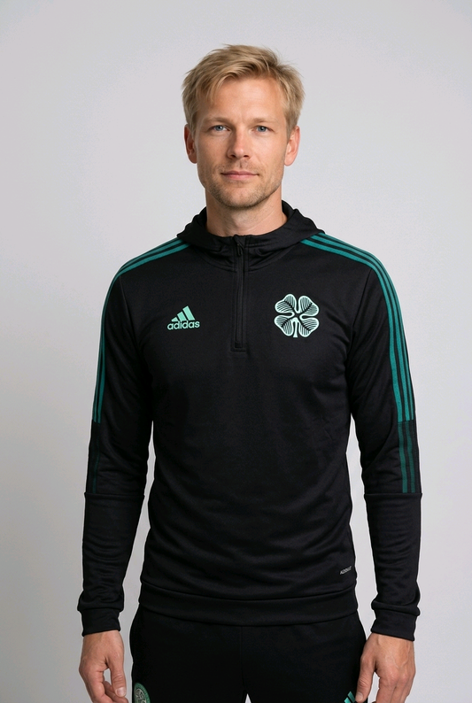 Man wearing a black Adidas sports jacket with Celtic 