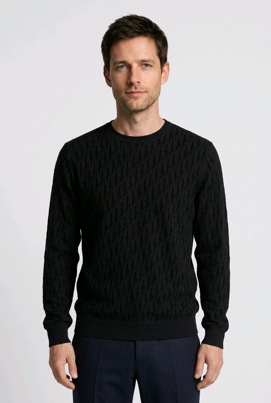 Man wearing a black cable knit sweater 