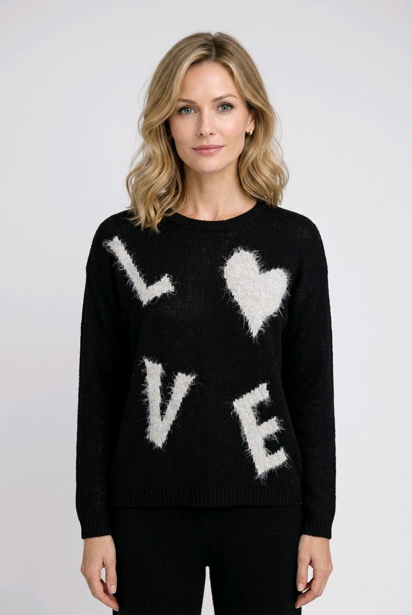 Woman wearing a black sweater with 'LOVE' and heart designs