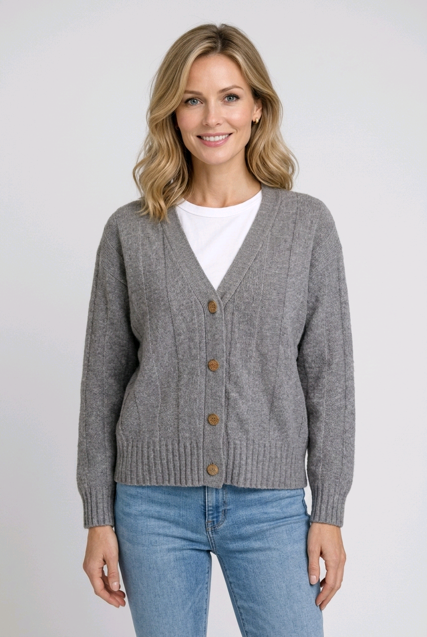 Woman wearing a gray cardigan with brown buttons