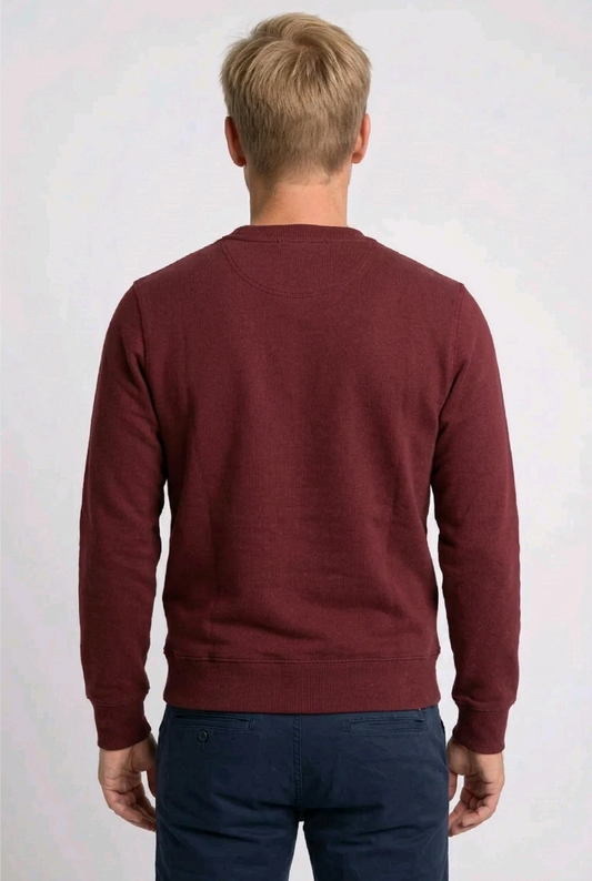 Person wearing a maroon sweatshirt